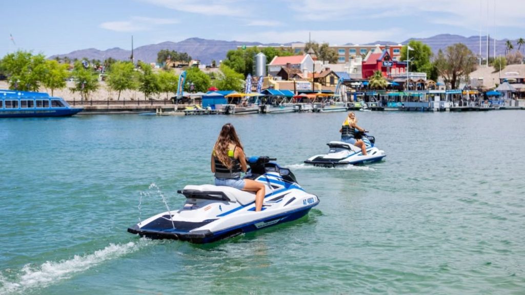 Jet Ski Riders On Lake